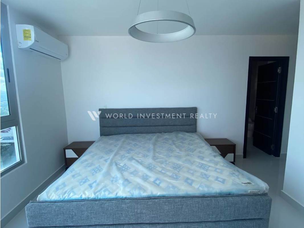 Bedroom with large windows and city skyline views at PH Top Tower Costa del Este Panama