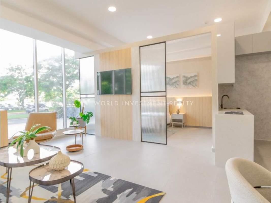 Studio-style living with large windows, partition wall, kitchenette in Seaside Tower Panama City