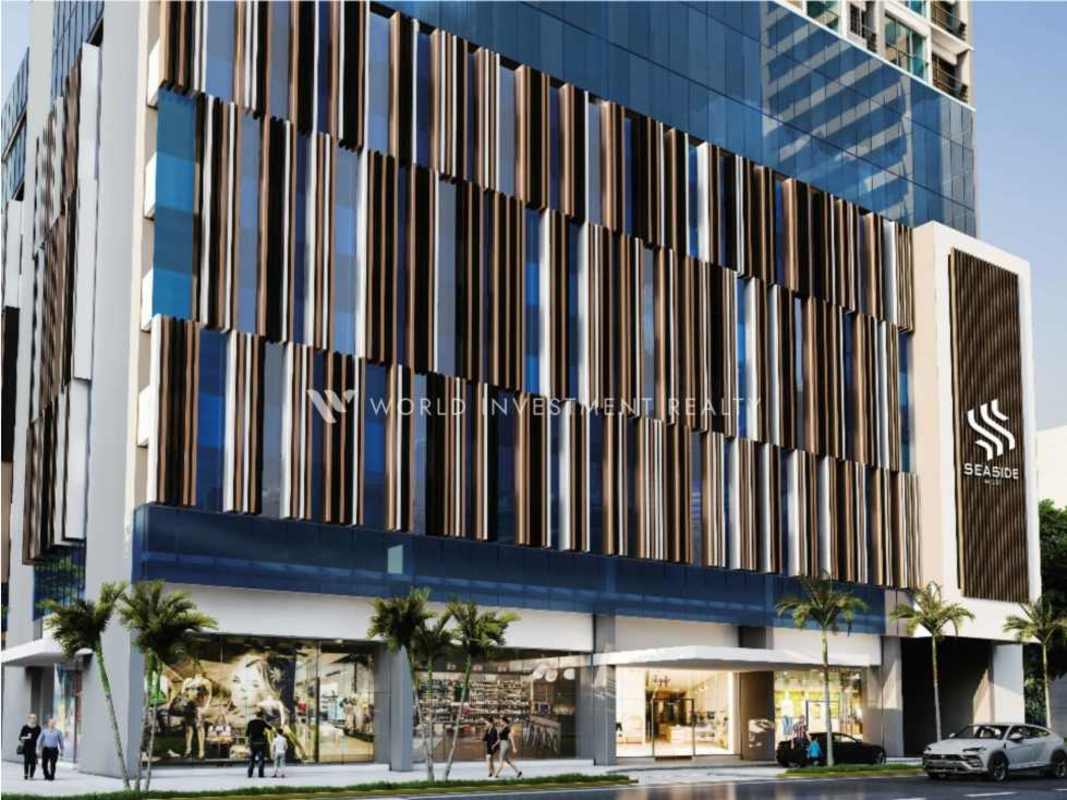 Spacious open concept living and dining with large windows at Seaside Tower Panama City