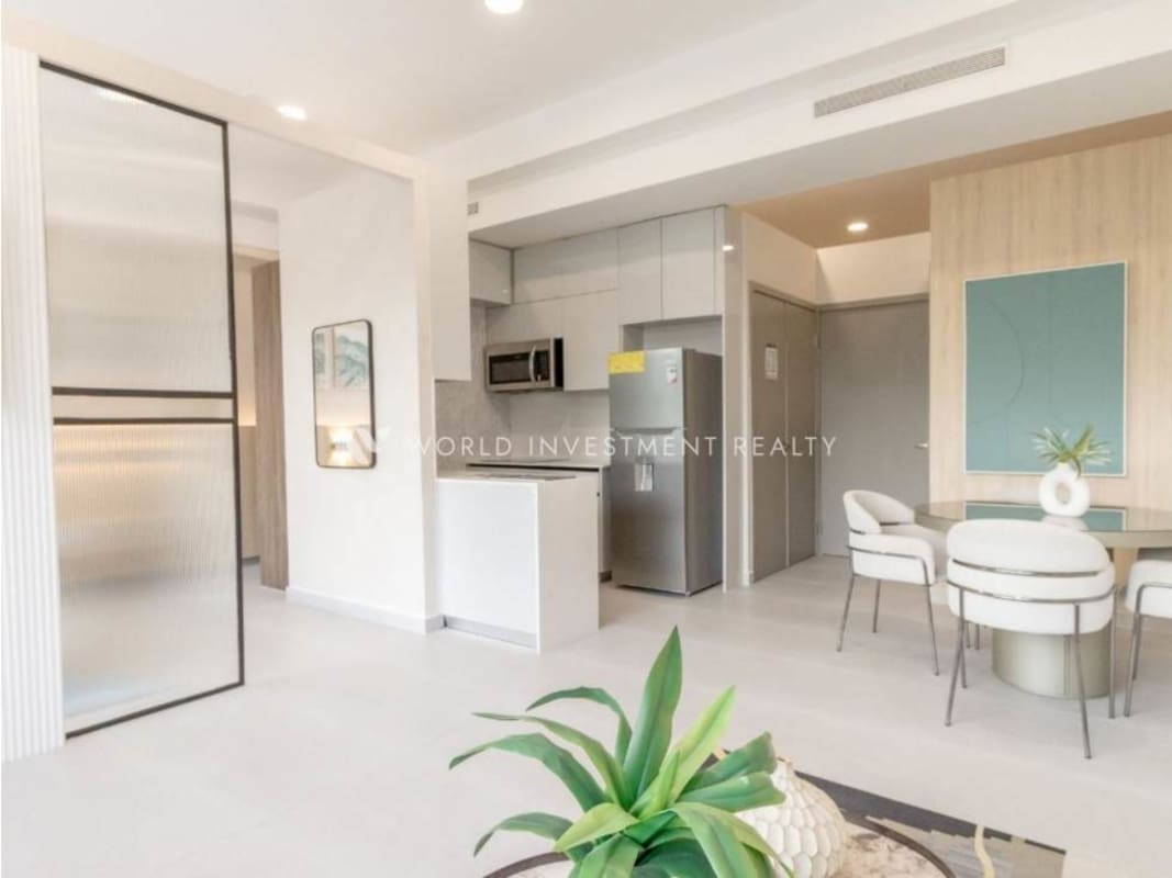 Open dining and living area with minimalist design at Seaside Tower Calle Uruguay