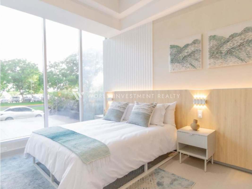 Bedroom with floor to ceiling windows, minimalist decor at Seaside Tower Calle Uruguay Panama