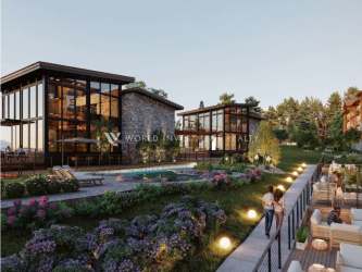 Villas with glass and stone facade, lush landscaping and swimming pool at Pino Alto Residences Boquete Panama