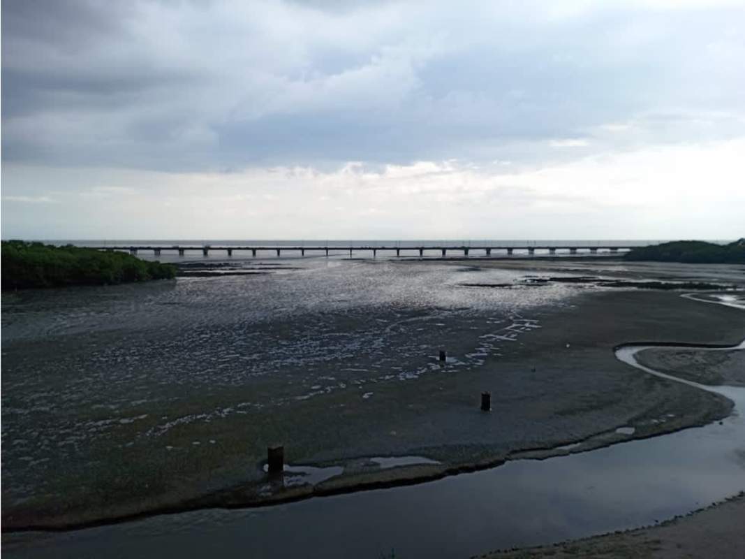 Spacious master bedroom with large window and ocean view in PH Baleares Panama City