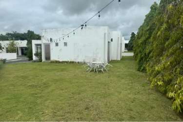 Modern single family villa with grassy lawn and patio at Ibiza Residences Río Hato Panama