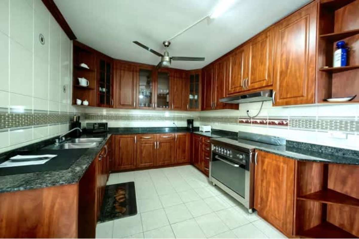 Expansive living room with marble floors and ocean panorama PH BICSA Panama City