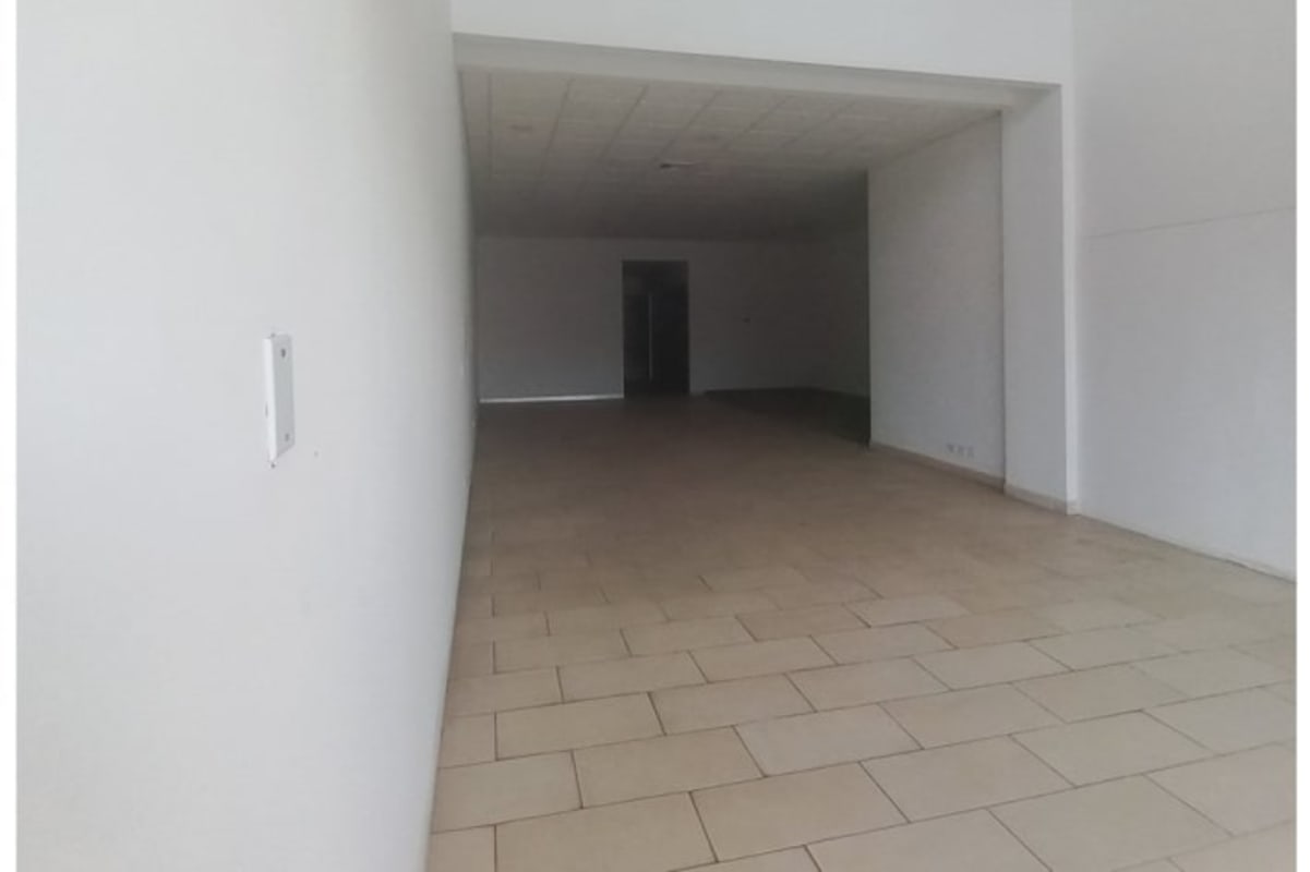 Second level open interior of commercial unit with tiled floor and white walls Costa del Este Panama