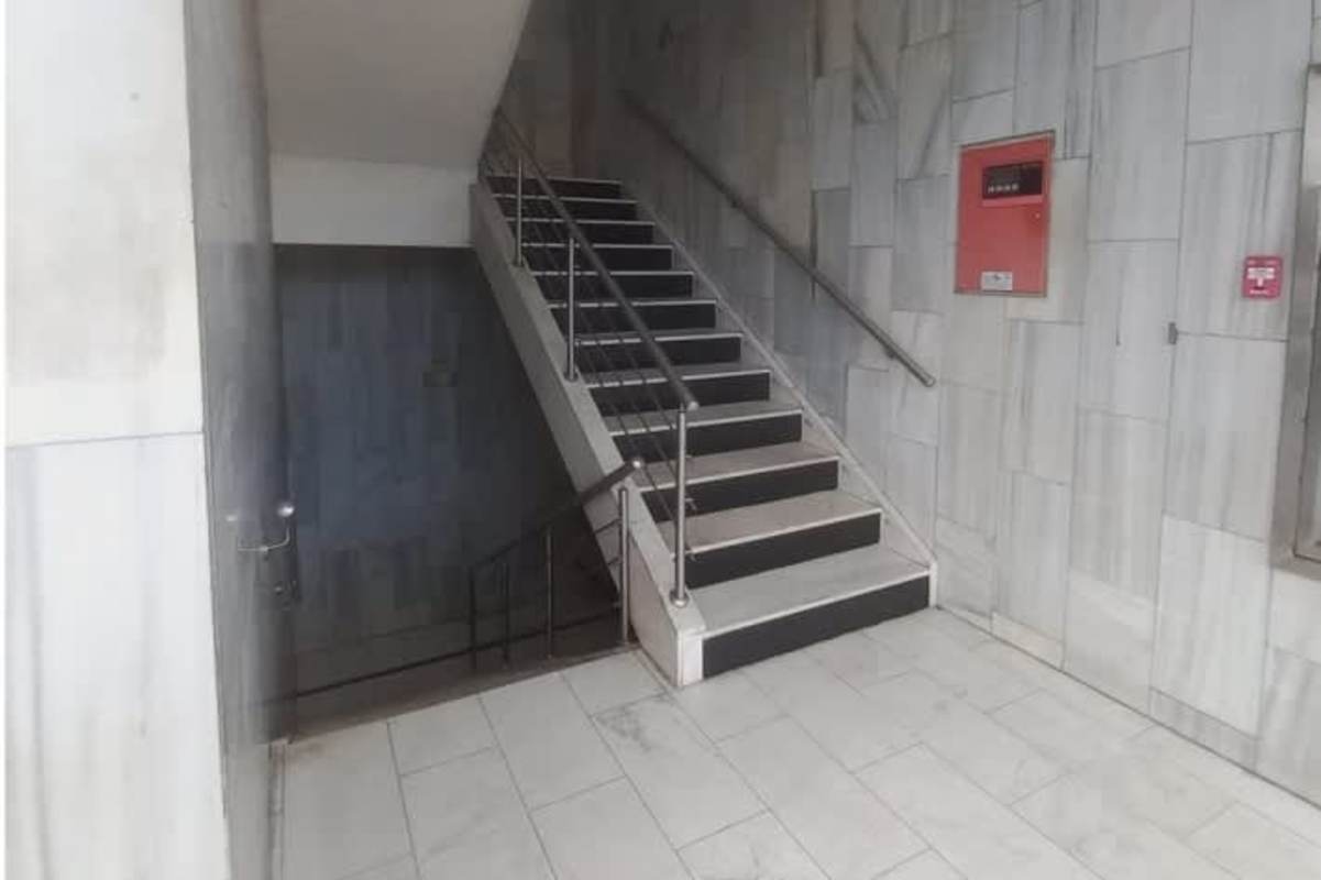 Indoor stairway with railing inside two-floor commercial unit Plaza Versalles Costa del Este