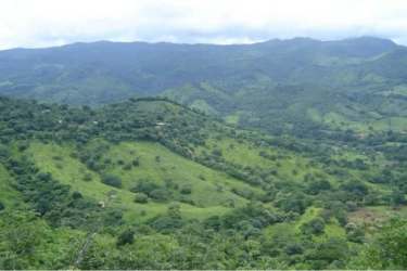 Mountain view landscape with green hills, pastures and forest for sale farmland Sora Chame Panama
