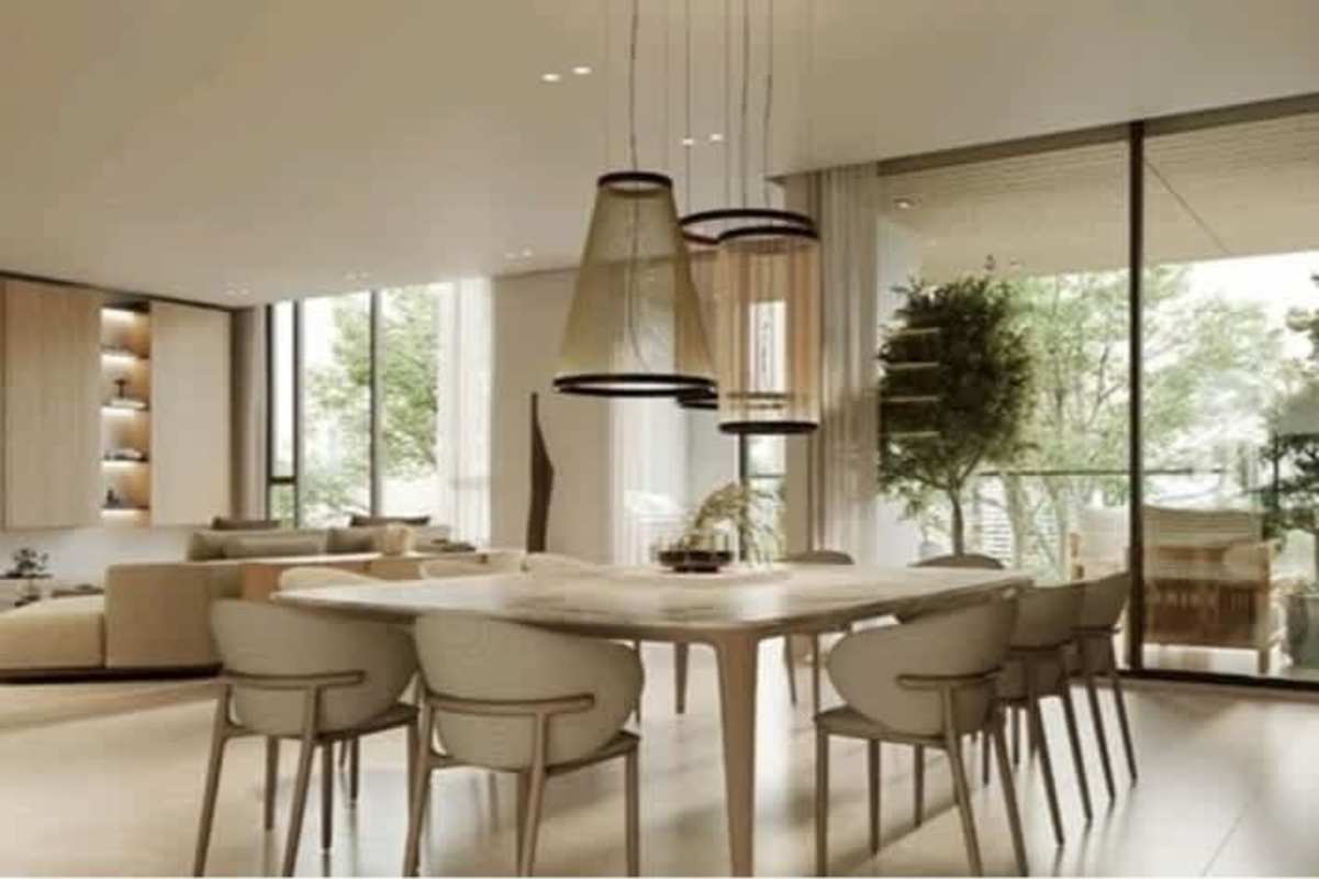 Elegant dining space with large table, pendant lighting, floor-to-ceiling glass in PH Blau Panama