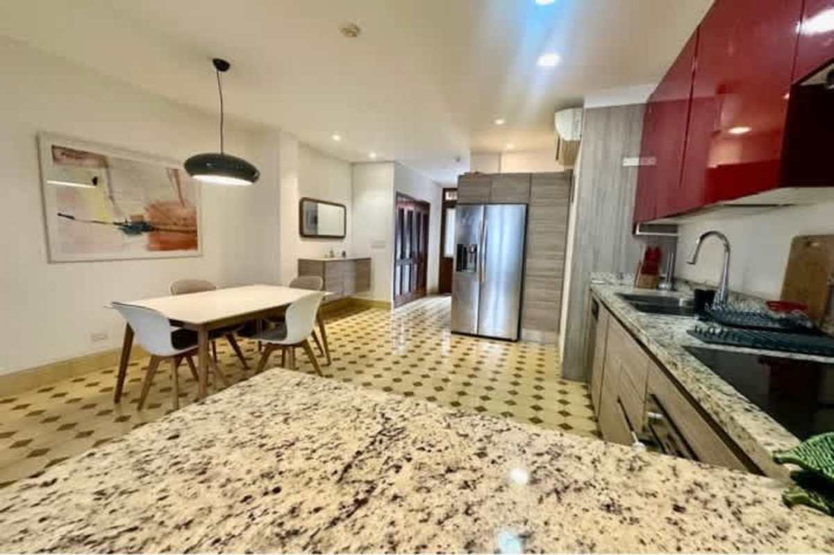 Modern bathroom with glass shower, hexagon tiles, floating vanity PH Casa Panamá Casco Viejo Panama