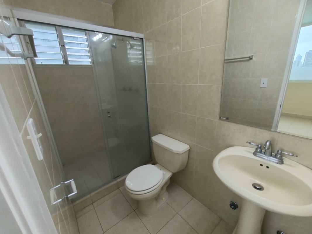 Bathroom with pedestal sink and glass enclosed shower PH Edison Plaza Panama