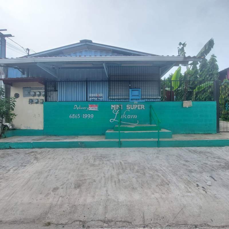 Access stairs and metal security bars with signage of mini supermarket container in Nuevo Tocumen Panama