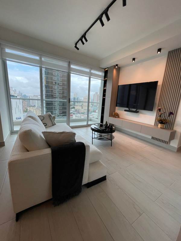 Dining area with black table large window pendant lights PH Urbana Obarrio