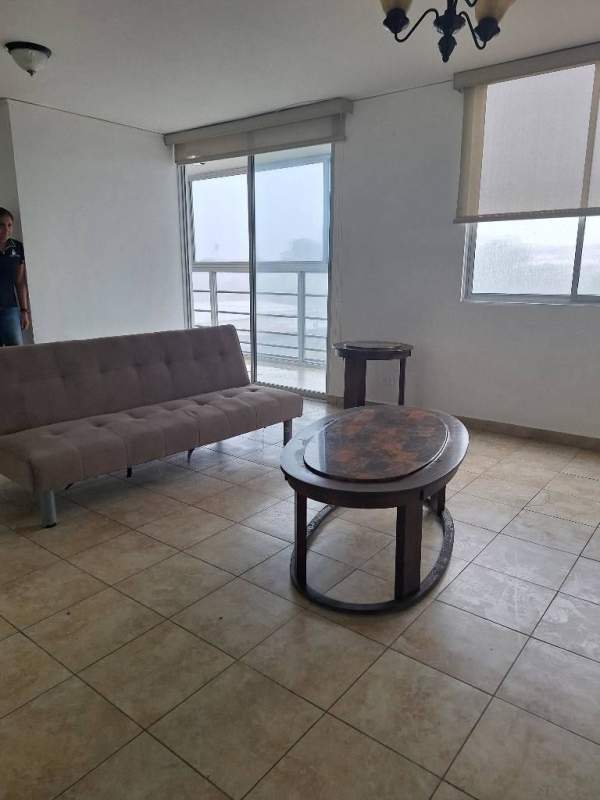 Bedroom featuring built-in white wardrobe, dark wood bed frame, ceiling fan in PH Cosmopolitan Tower Panama