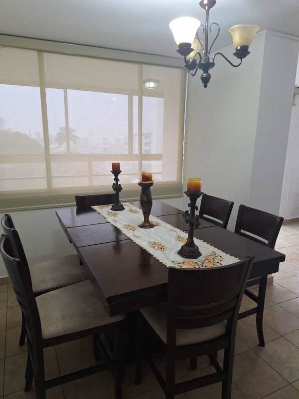 Laundry with washer dryer stacked, fridge, window with curtains in PH Cosmopolitan Tower Panama