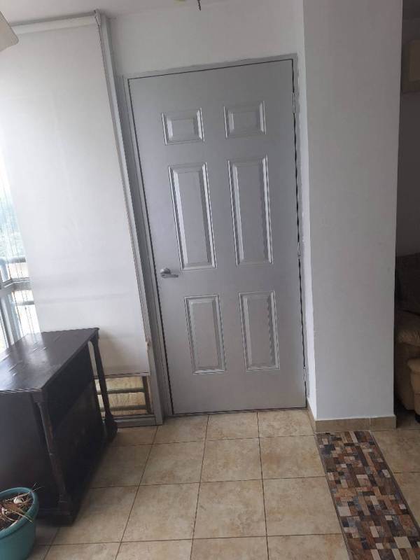 Hallway entry with grey door, mosaic tile border floor, large window, sunlight entry at PH Cosmopolitan Park.