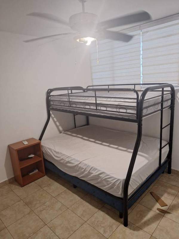 Bedroom with bunk bed, ceiling fan, tiled floor, window blinds PH Cosmopolitan Park.