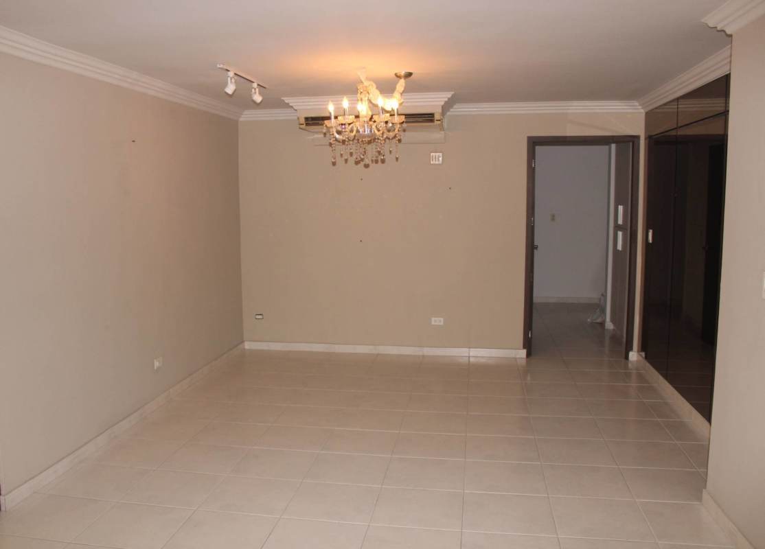 Spacious living room with city view balcony at PH La Fontana Obarrio Panama City