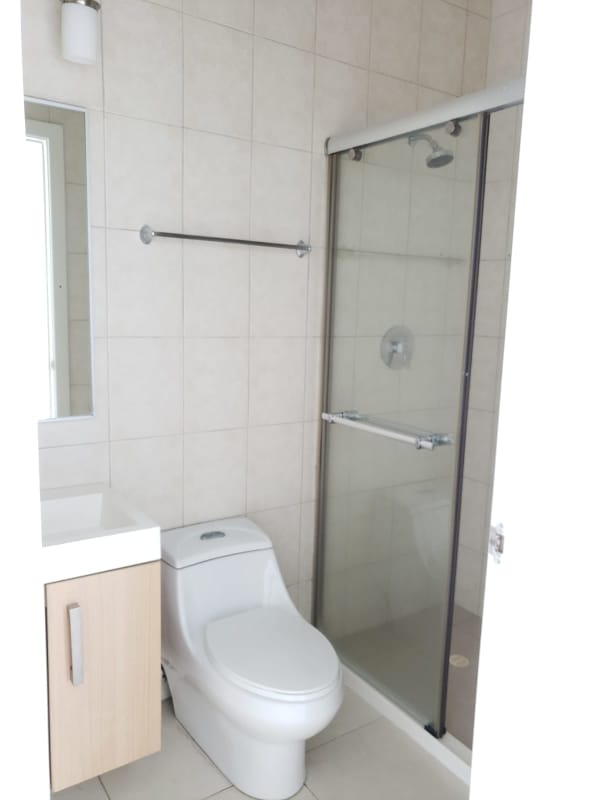 Bathroom with glass enclosed shower, vanity and modern fixtures PH Coco del Mar Panama City