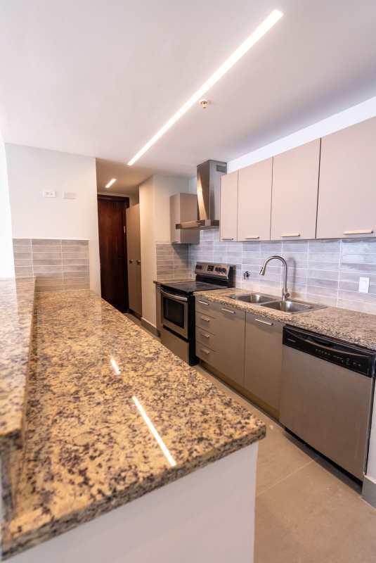 Bright bedroom with ocean views large windows en-suite bathroom at PH Ocean Aire Punta Pacifica Panama