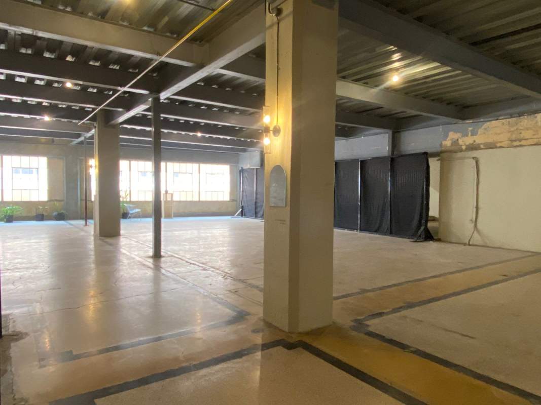 Spacious industrial interior with large windows and exposed steel beams Casco Viejo Panama