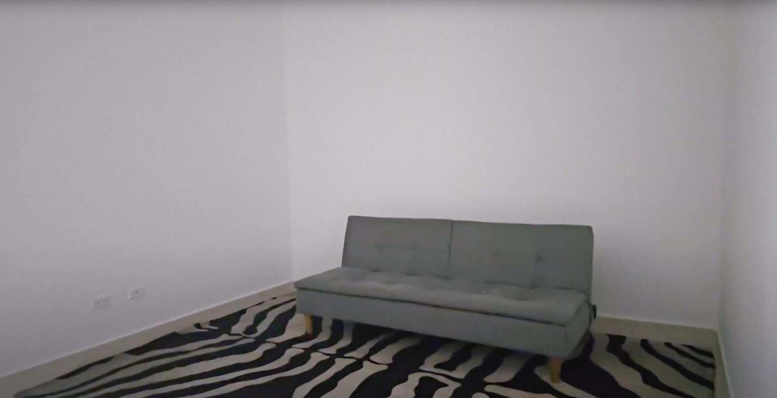 Spacious living room with floor to ceiling windows and balcony access PH White Tower Panama