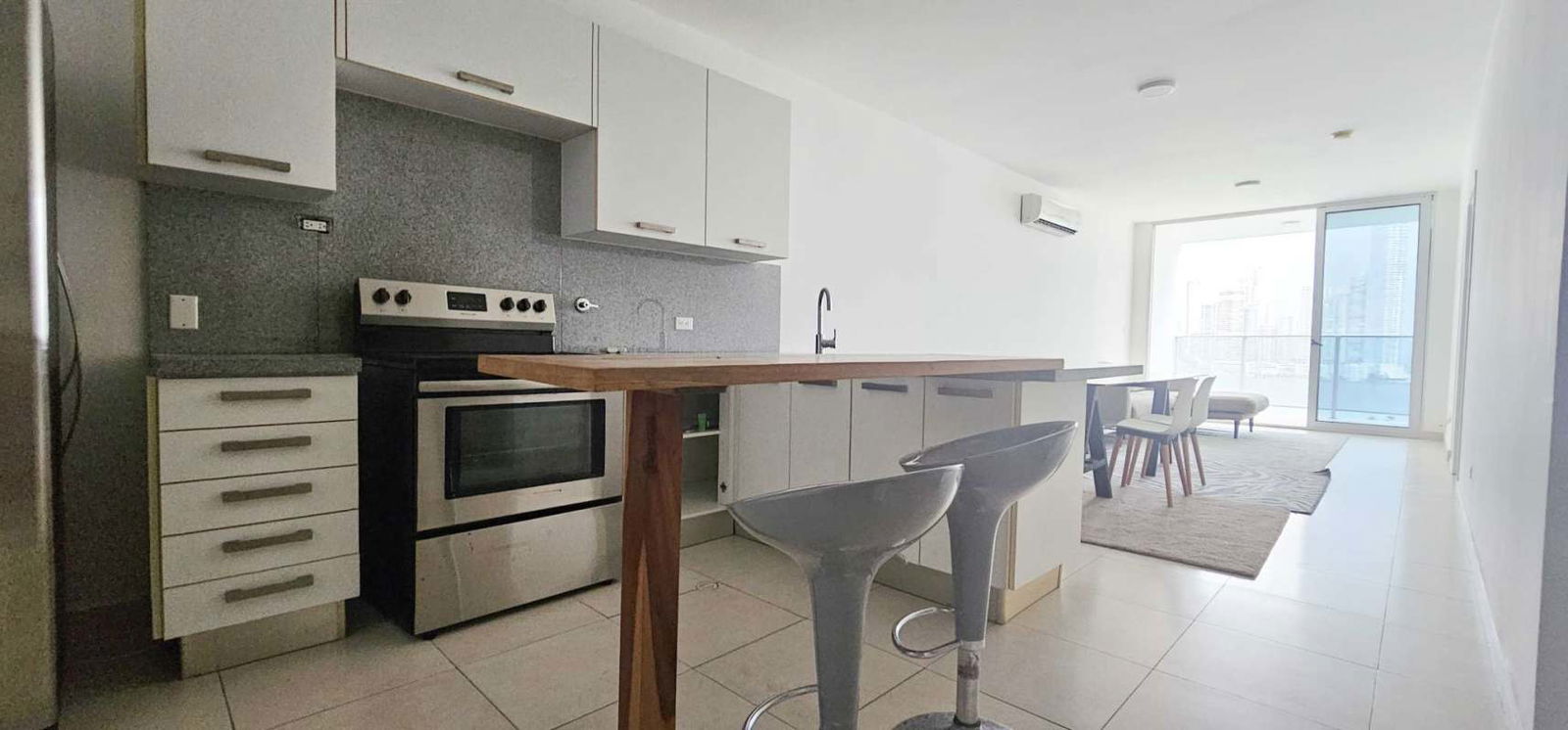 Kitchen with breakfast bar open dining area ocean views PH White Tower Panama City