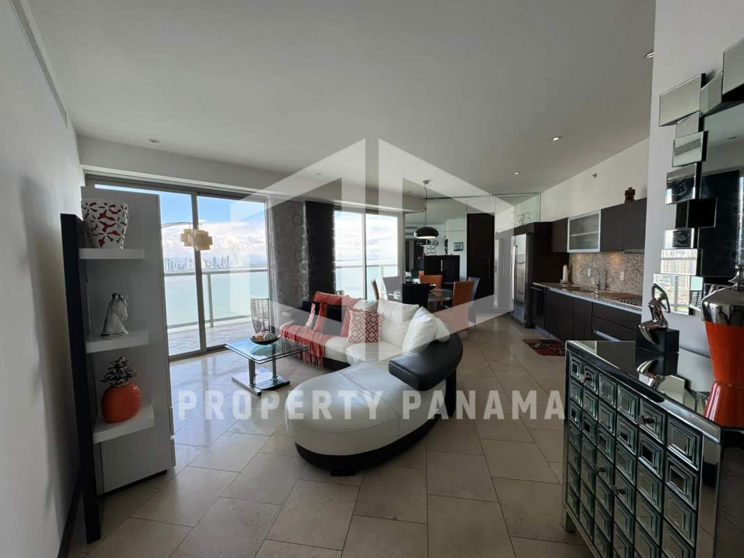Gourmet kitchen with central island, dining space and stunning ocean backdrop at The Ocean Club Panama City