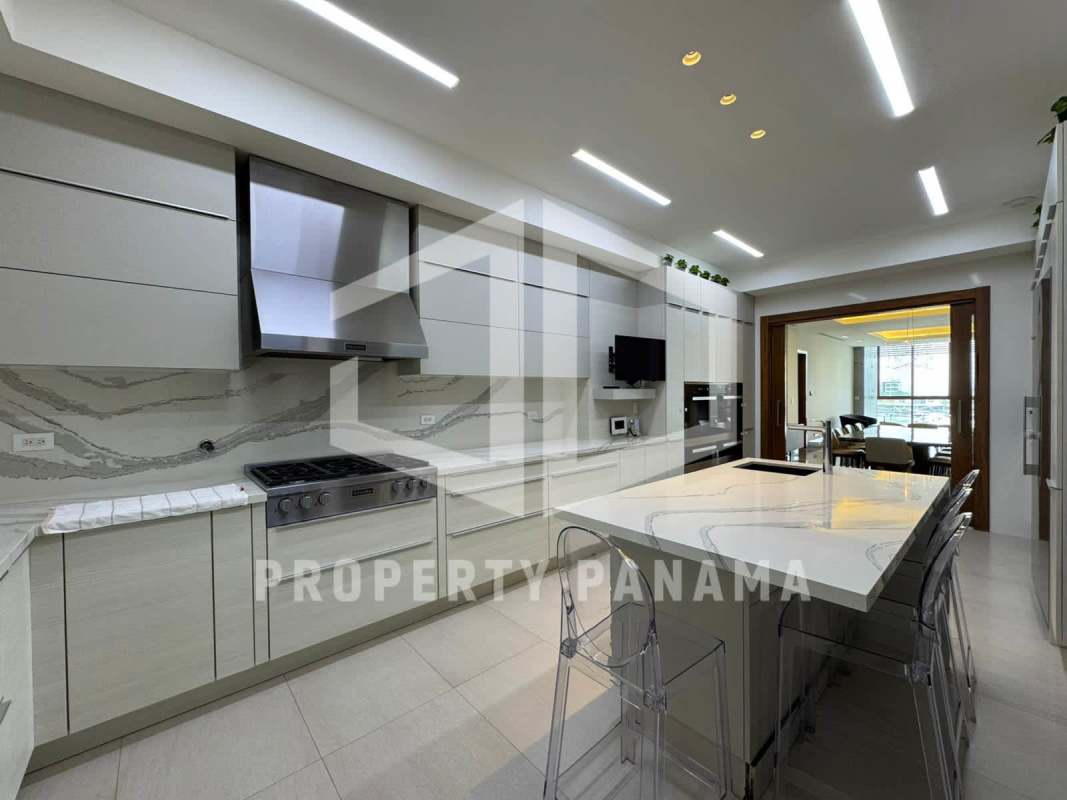 Luxury bathroom with marble walls, glass shower and double vanity at Ocean Reef Panama