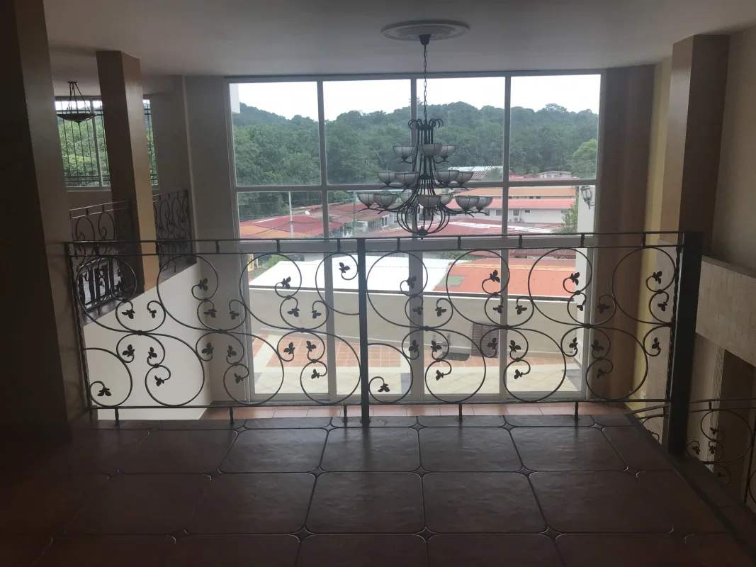 Bedroom with built-in wardrobes AC tile floors natural light in Villa de las Fuentes Panama