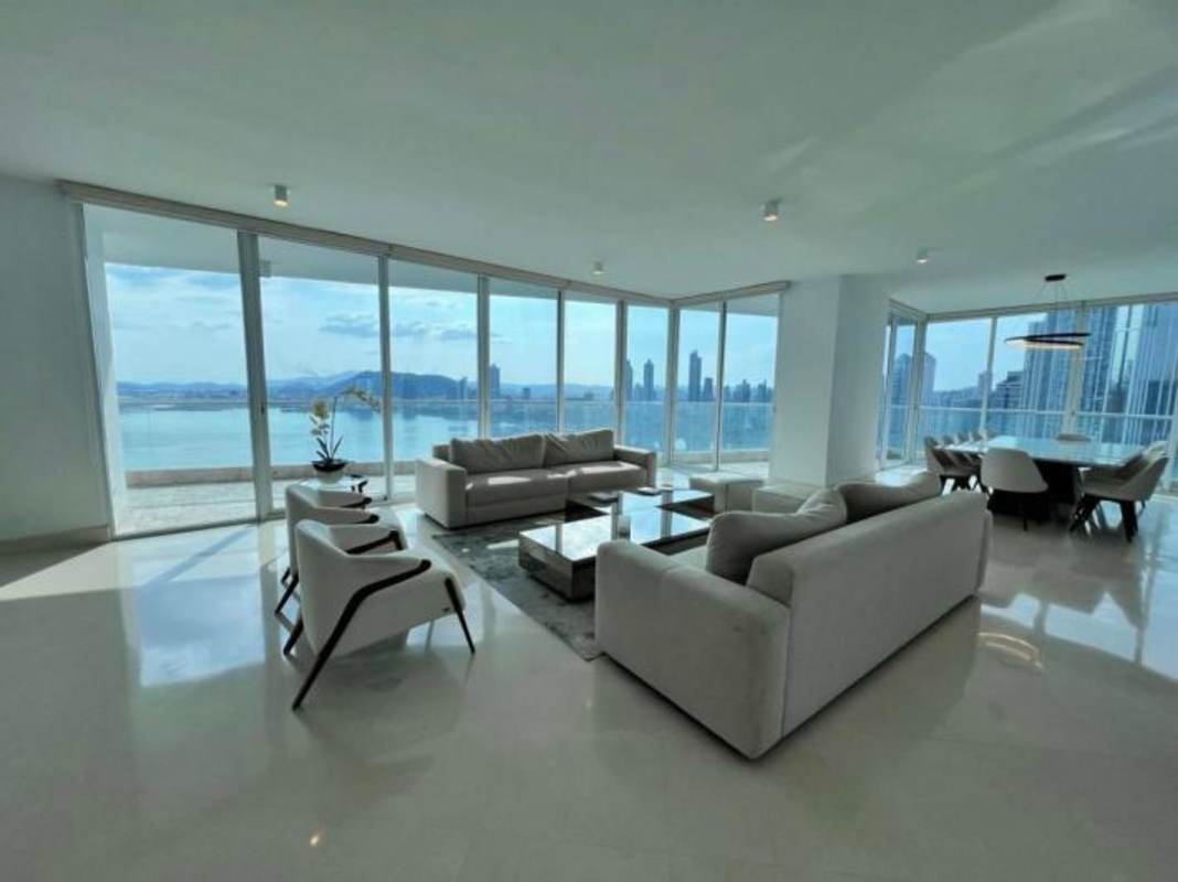 Open concept living and dining with marble flooring and floor-to-ceiling panoramic Pacific views PH The Point