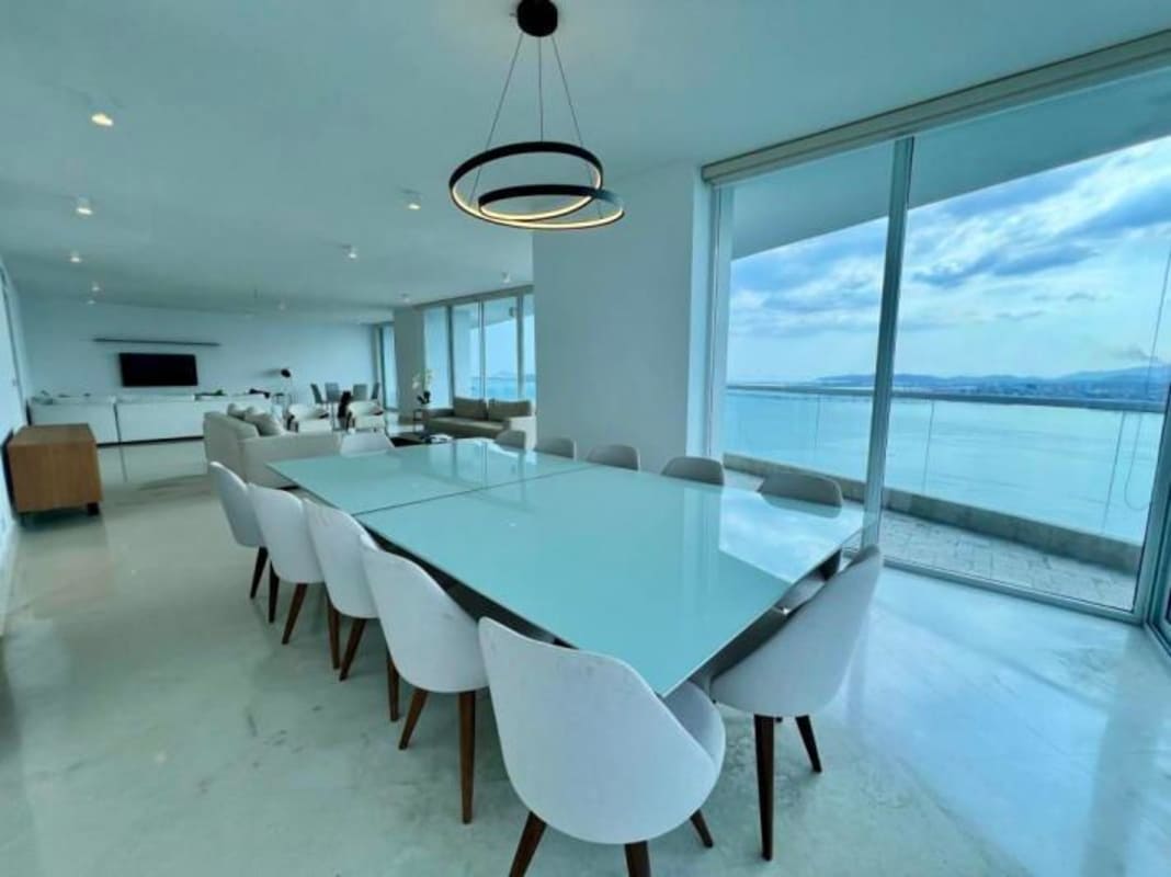 Contemporary kitchen with granite island and ocean view windows at The Point Tower Punta Paitilla