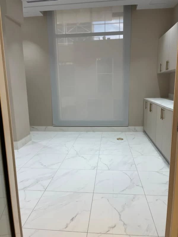 Bright empty office room with marble tile floors, built-in cabinets at Town Center Punta Pacifica