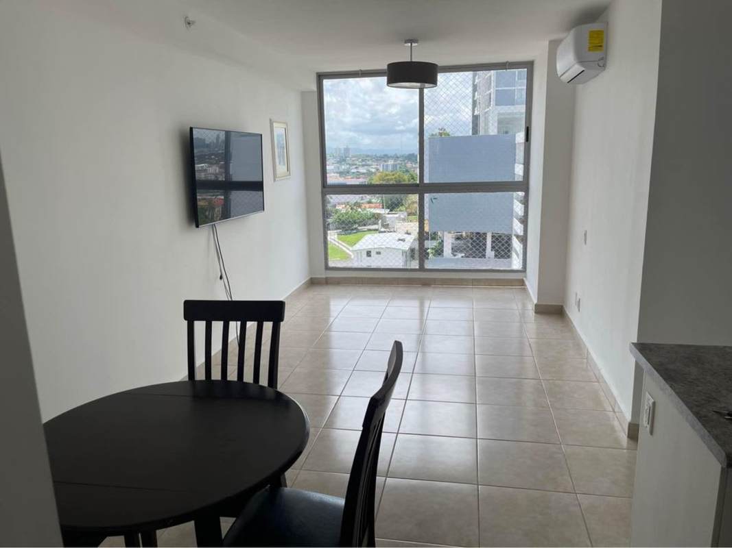 Bright living and dining area with large windows city views open layout PH Studio 12 Panama City