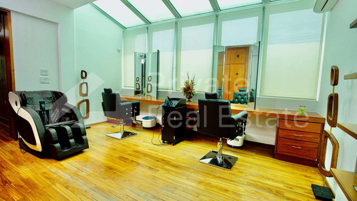 Scavolini gourmet kitchen with marble countertops, island and built-in appliances in luxury Panama mansion