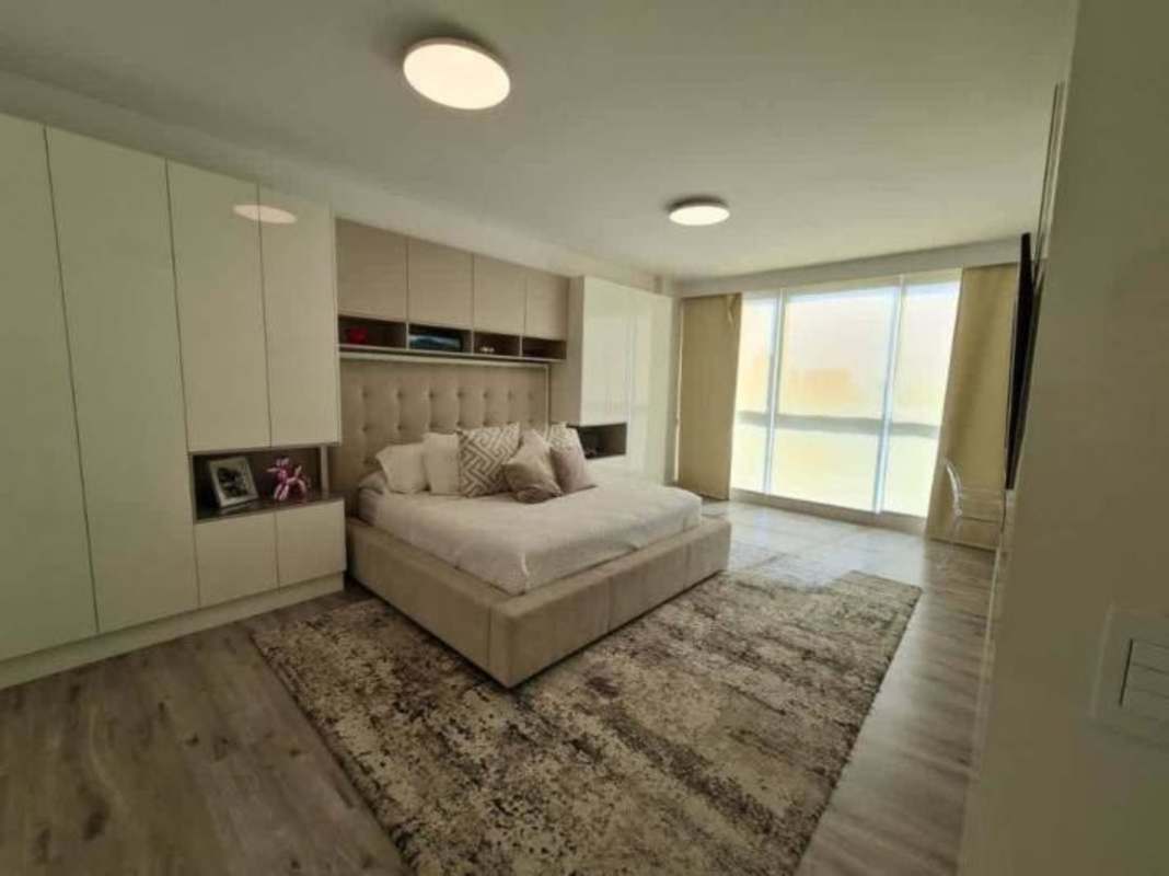 Spacious bedroom floor-to-ceiling windows ocean view built-in closet Pacific Point Panama