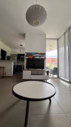 Modern kitchen with granite counters and cabinetry in PH Mosaic Panama Pacifico