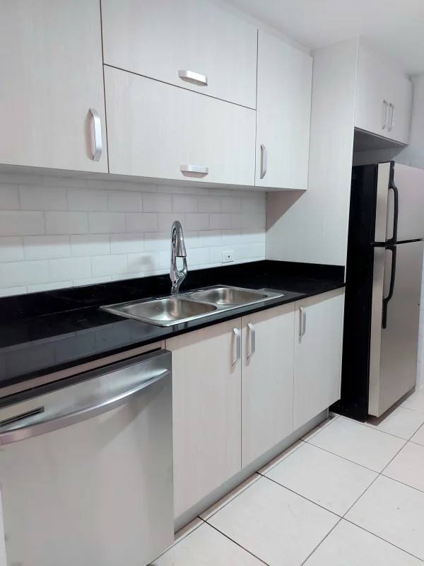 Modern high-rise condo tower facade with balconies in PH Coco del Mar San Francisco Panama City