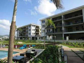 Kitchen with modern cabinets, appliances and breakfast bar in PH Mosaic Panama Pacifico