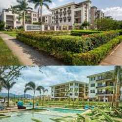 Swimming pool and clubhouse amidst landscaped gardens in PH Mosaic Panama Pacifico