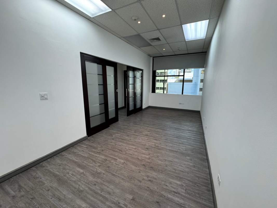 Hallway with glass-panel doors and window light in PH BICSA Panama