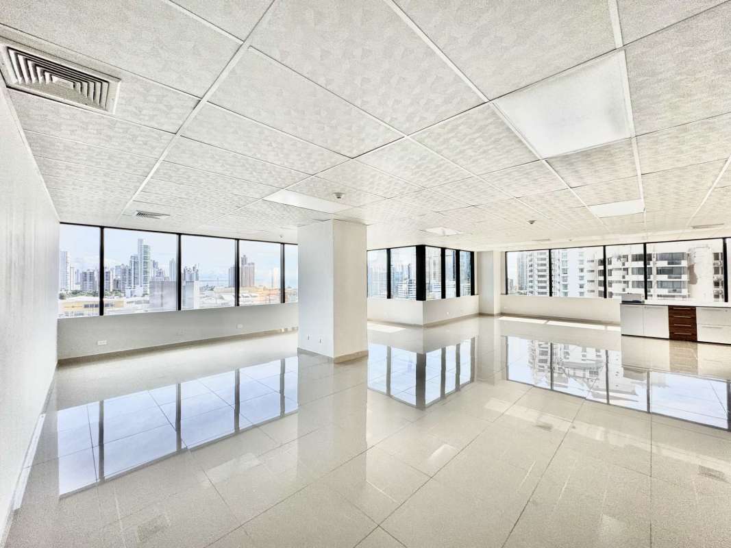 Modern open-plan office with panoramic windows overlooking Panama City in PH BICSA Tower Punta Pacífica