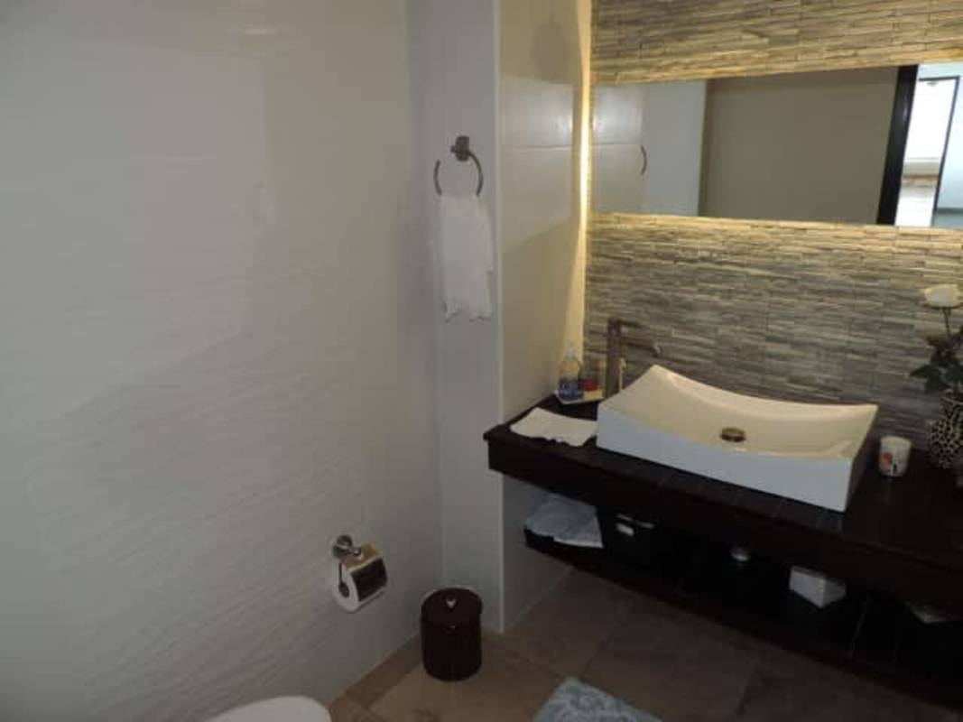 Luxury bathroom with vessel sink and illuminated mirror Costa del Este Panama