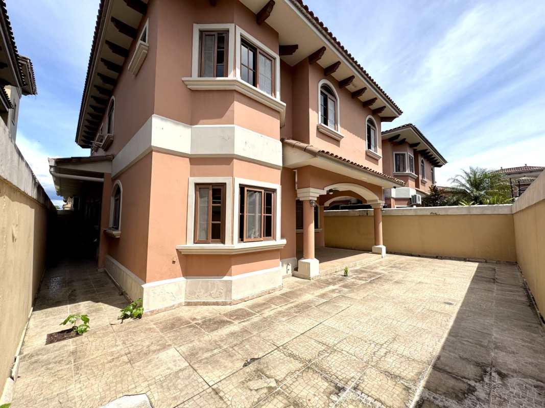 Kitchen with granite countertops, bay windows, and modern cabinetry in Costa Sur Panama home