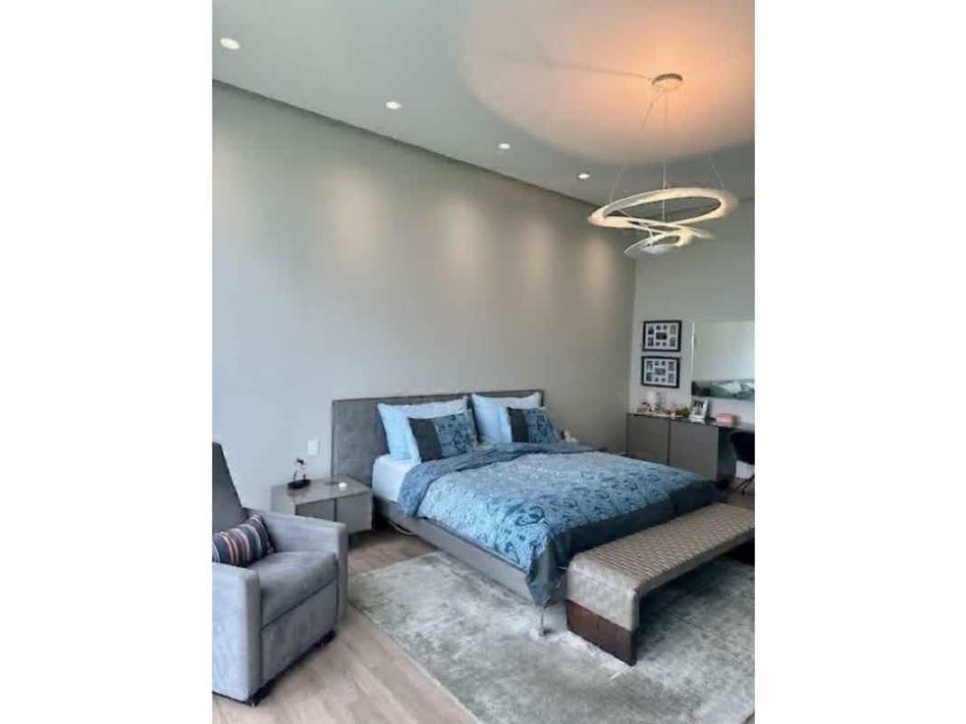 Luxury master bedroom with golf course view and walk-in closet at The Reserve Santa María Panama