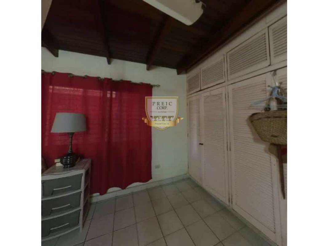 Bedroom featuring wood ceiling, tiled floors, and closet Bethania Panama property for sale