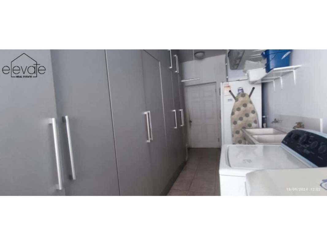 Dining space with marble floors, tray ceiling, chandelier PH Mirage Punta Paitilla Panama City