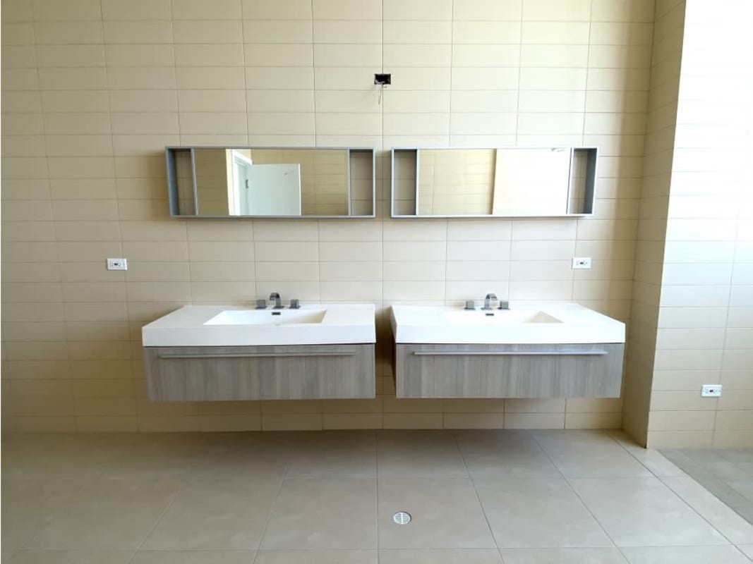 Elegant bathroom with glass shower and marble accents PH Waters on the Bay Panama City