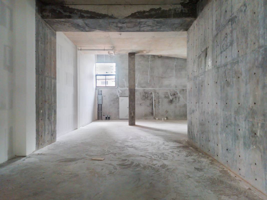 Unfinished industrial style commercial interior exposed concrete Nouvo Armani Plaza Bella Vista Panama