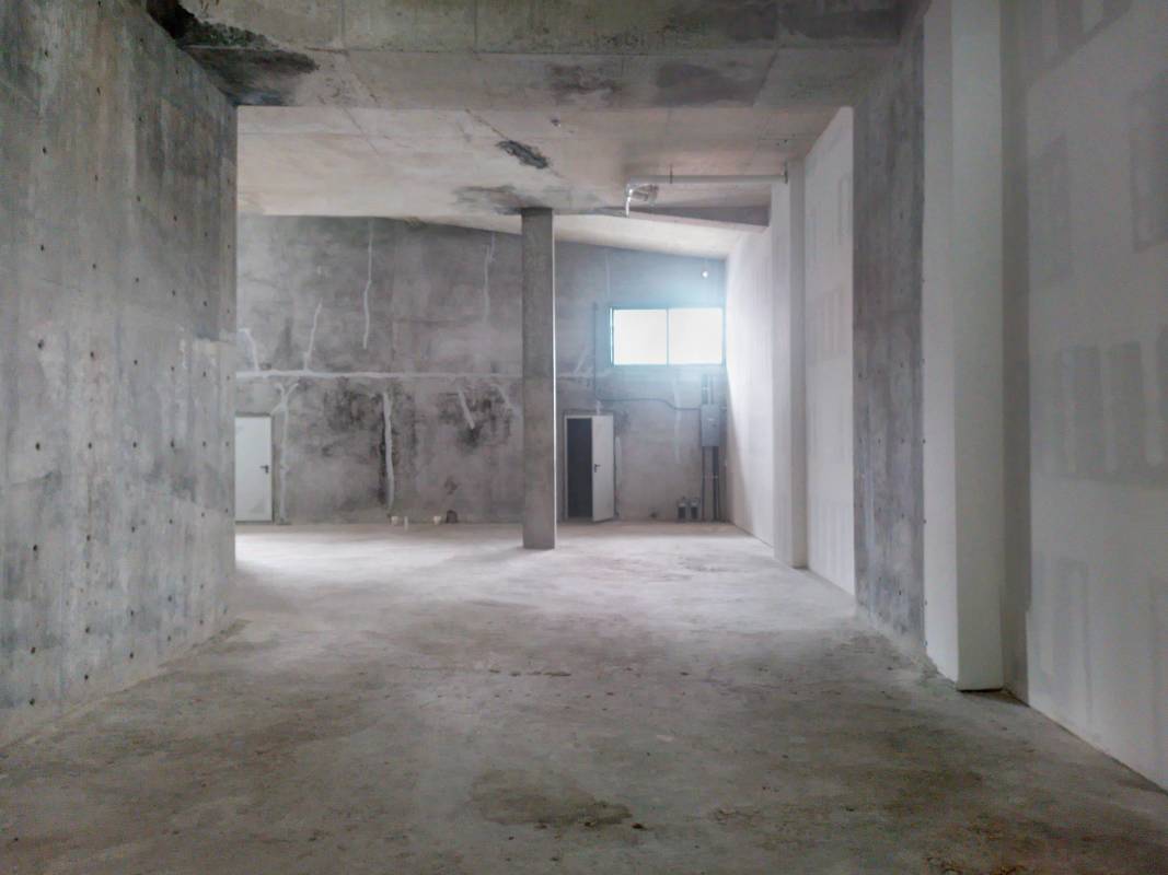 Spacious dining or retail area with modern design glass walls and black tables Nouvo Armani Plaza Panama City